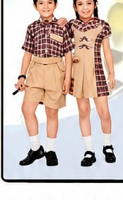 Boy and girl in khaki day uniforms